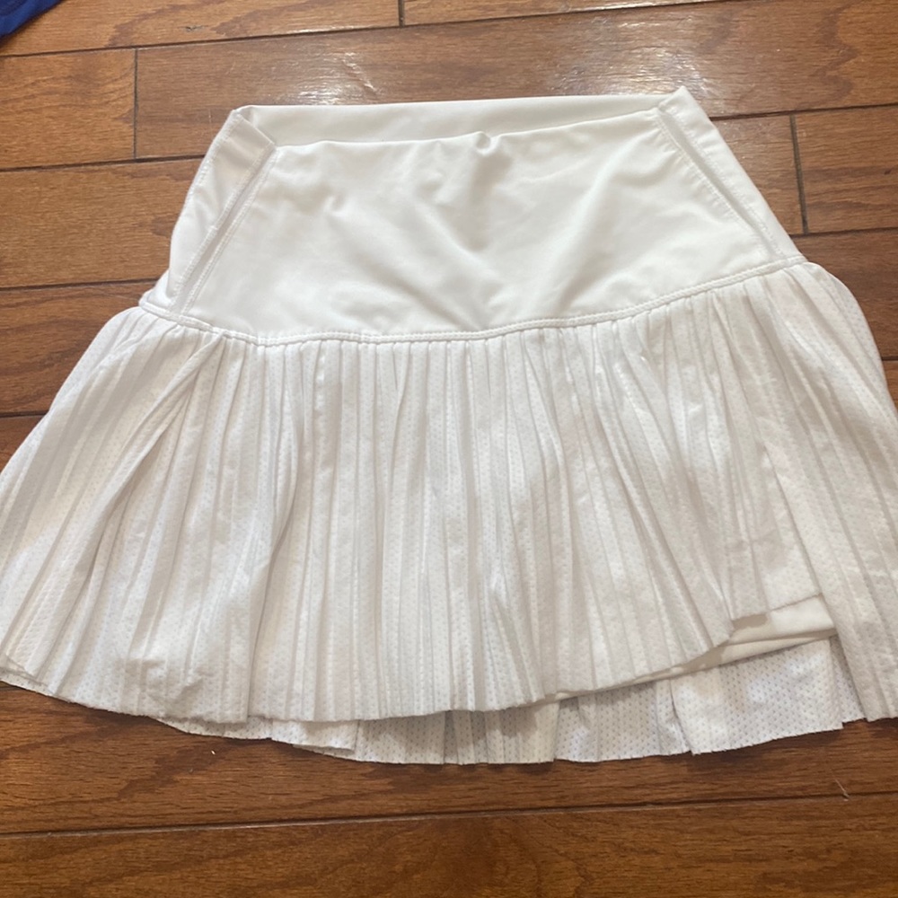 Like new lucky in love tennis skirt. High low size small